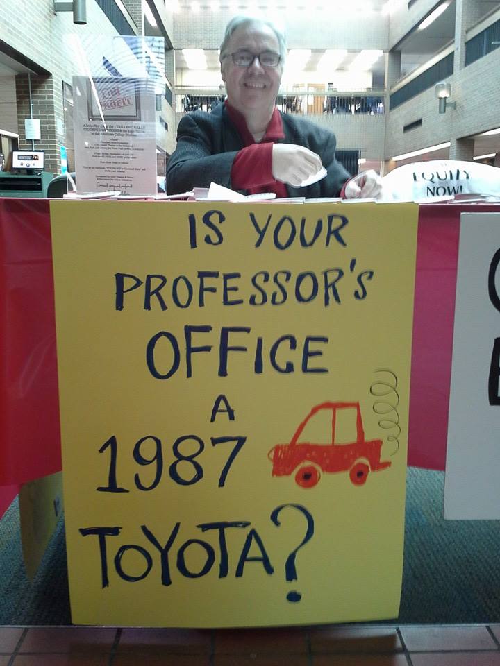 David Wilder, co-chair of the organizing committee of the Ohio Part-Time Faculty Association, staffs a CEW table at Cuyahoga Community College, West campus, in Parma, Ohio.